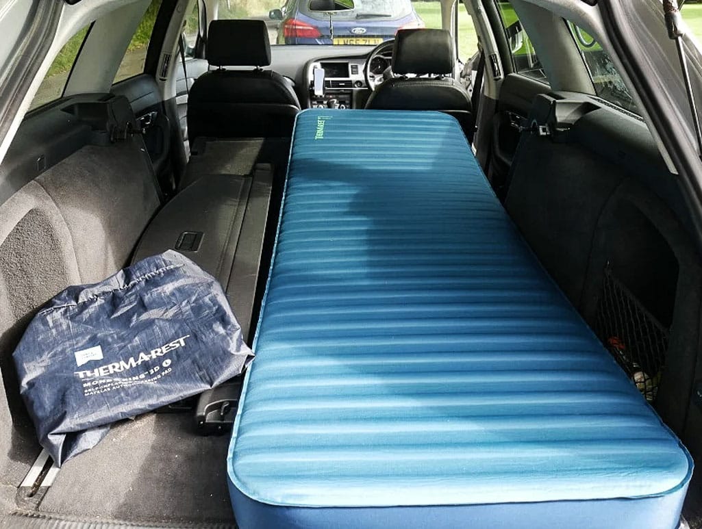 Amazing camper build for comfortable sleeping in a 2017 Toyota RAV4 that stows away in the rear cargo area made by the conversion shop of Camp N Car in Port Townsend Washington.